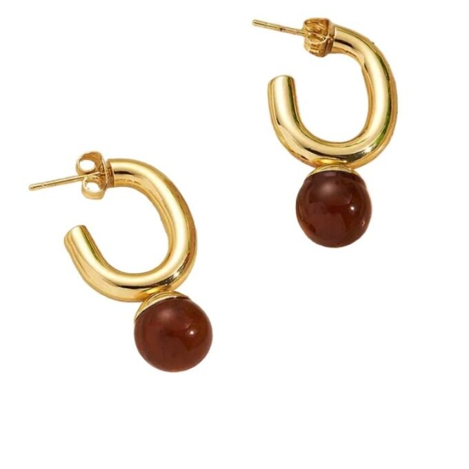 Earrings of steel with red sofa
